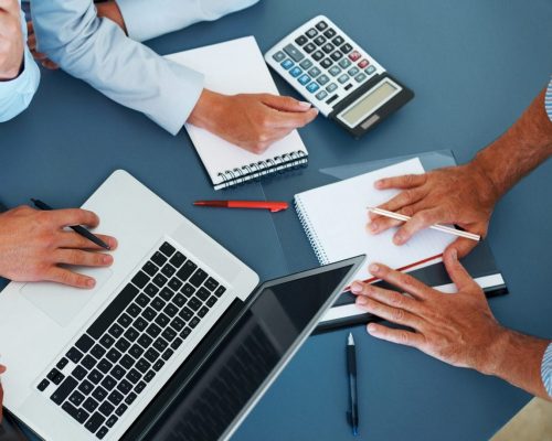 Cropped image of group of businesspeople working together in office - Consulting